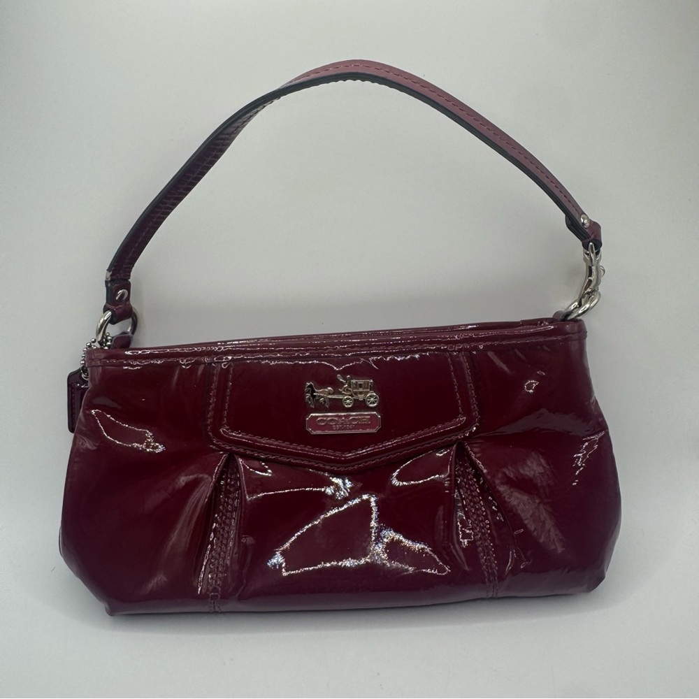 Coach Madison patent leather 
Use as a wristlet or small purse